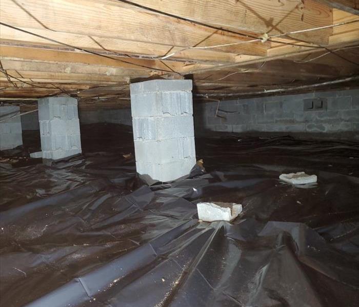 crawlspace with new vapor barrier